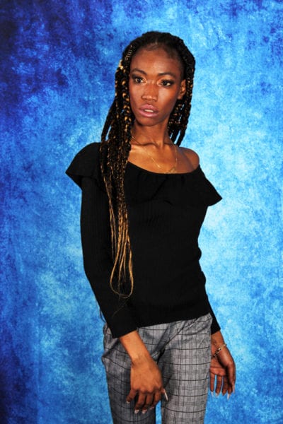 Jennypher, models - black model with braids against blue backdrop