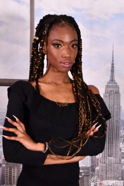 Jennypher, models - Haitian model with cityscape backdrop