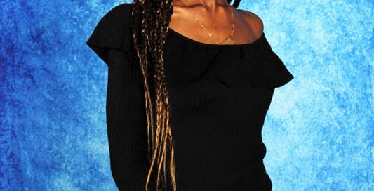 Jennypher, models - black model with braids against blue backdrop