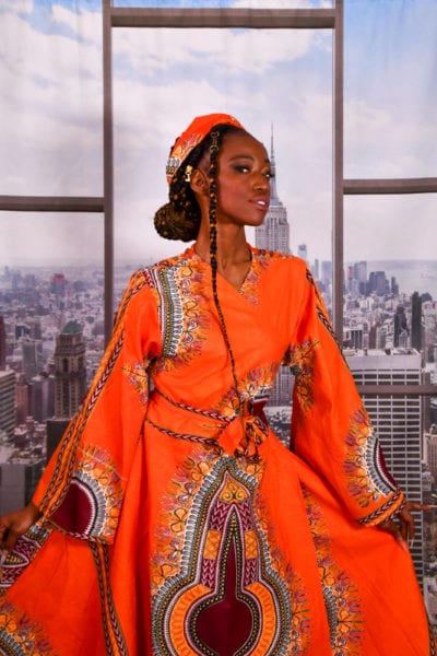 Jennypher, models - black mdel in bright orange african dress