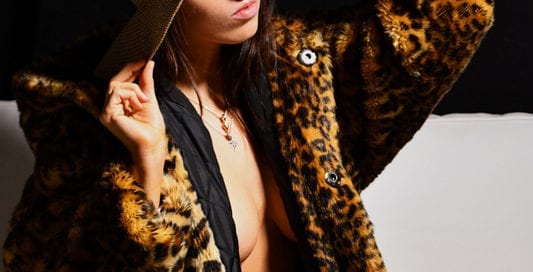 Kitti - Brunette model in leopard print jacket and hat