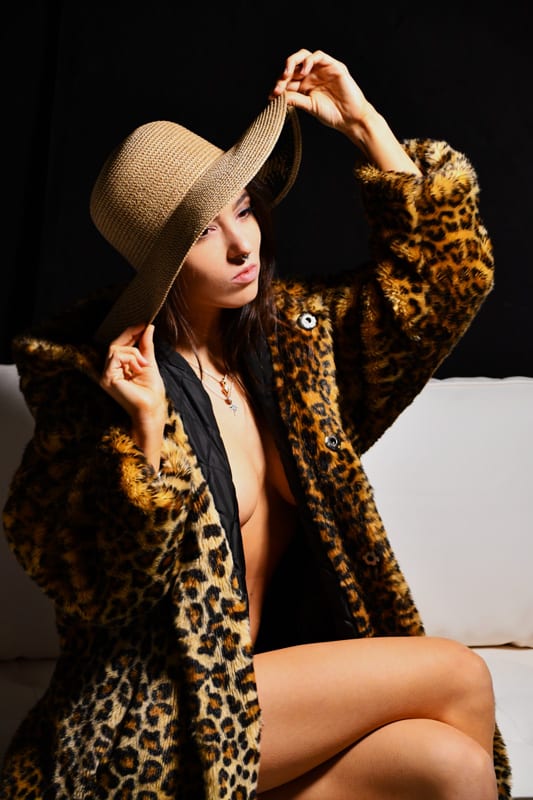 Kitti - Brunette model in leopard print jacket and hat