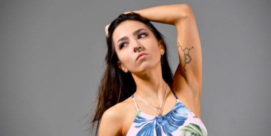 Kitti - Portrait of model on grey background