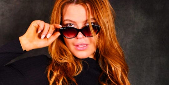 Leah model - redhead with glasses