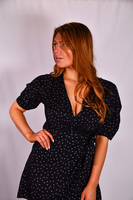 Leah Model, profile shot of redhead model in dark dress