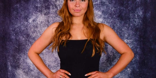 Leah, models - redhead young woman in jeans and a black top
