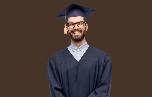 family photo - male graduate on brown backdrop