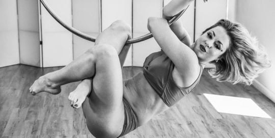 Rebecca - blonde model on lyra hoop in black and white