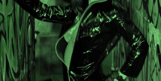 Aubrey - model in leather jacket under green light
