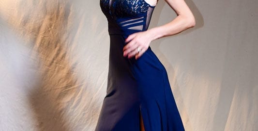 model abbie in blue dress looking down