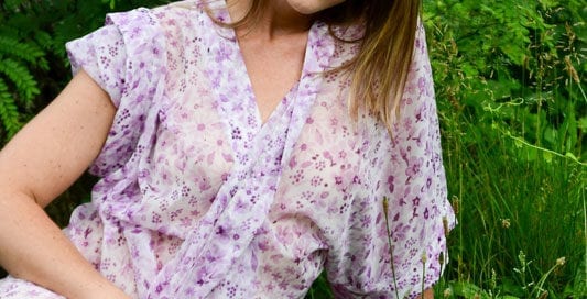 Erica model in grass by a tree