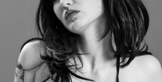 black and white image of alternative goth model bust shot