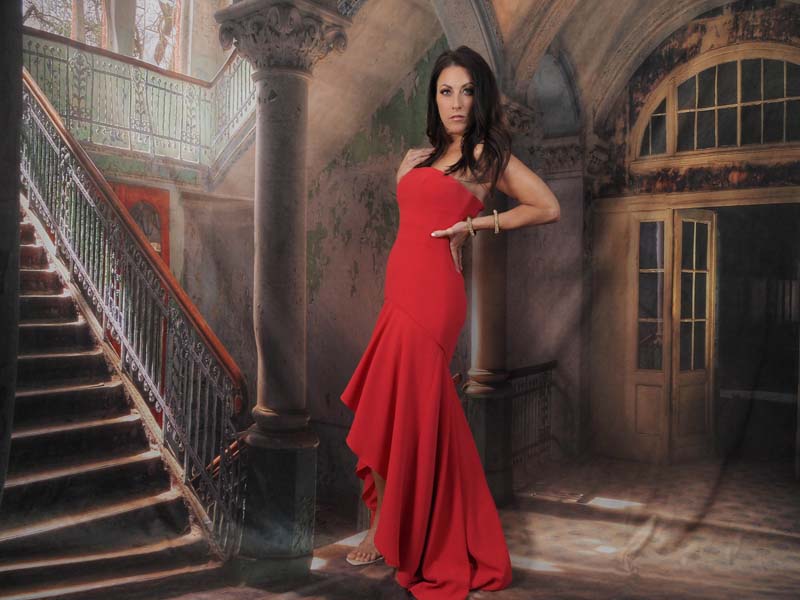Alissa -Brunette model in red dress on mansion backdrop
